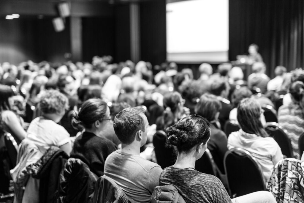 Speaker giving presentation on scientific business conference